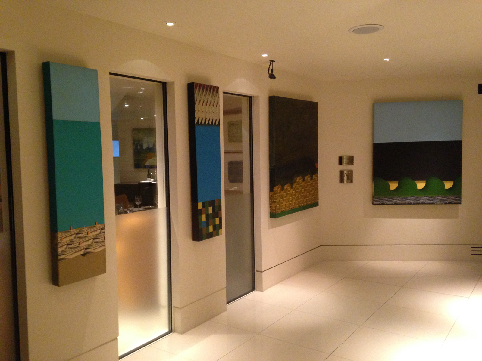 Commissioned paintings displayed outside Indigo restaurant at One Aldwych