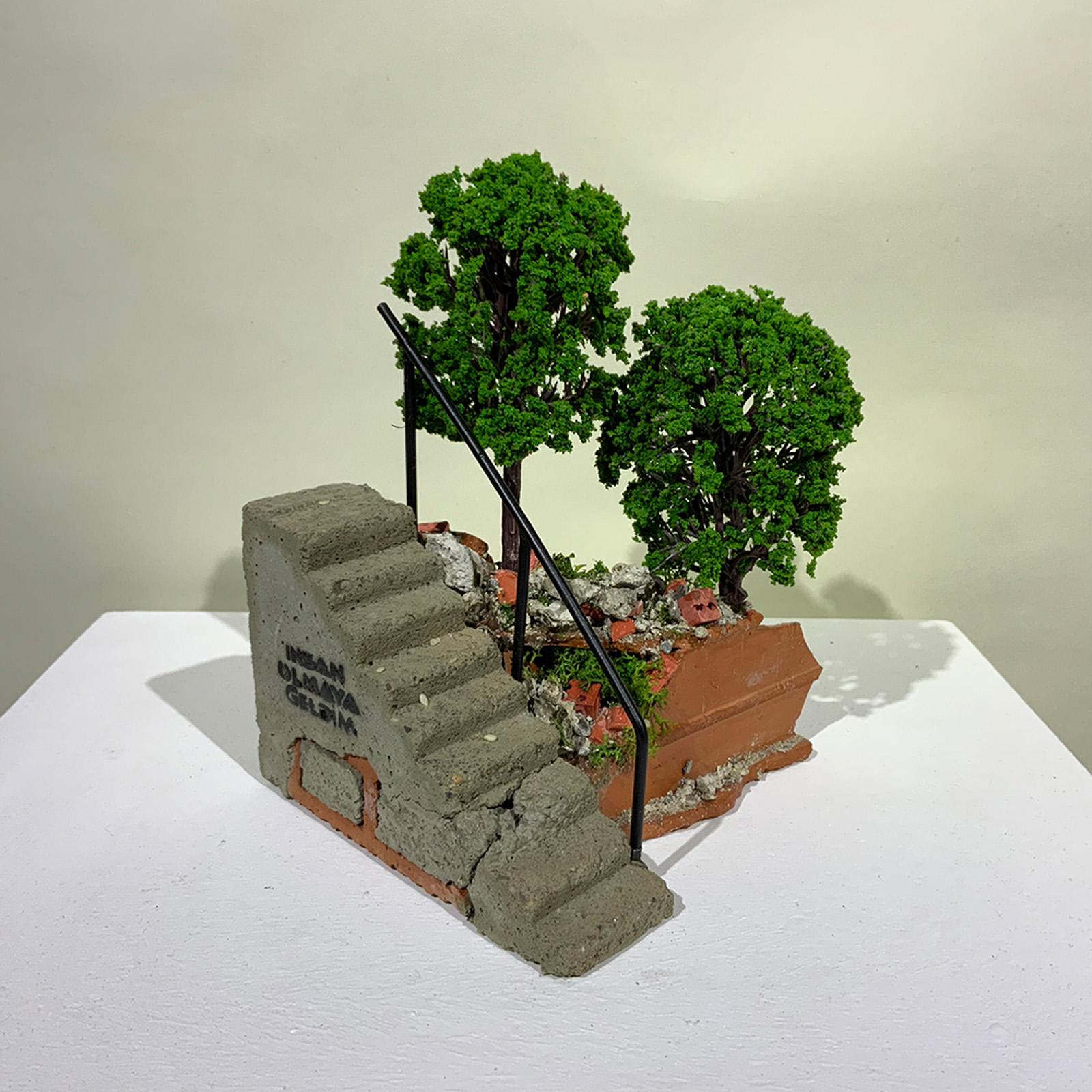 A miniature sculpture of a steps from On the Rubble of our Ancestors