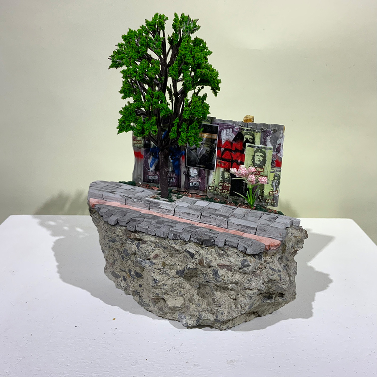 A miniature sculpture of street hoarding from On the Rubble of our Ancestors