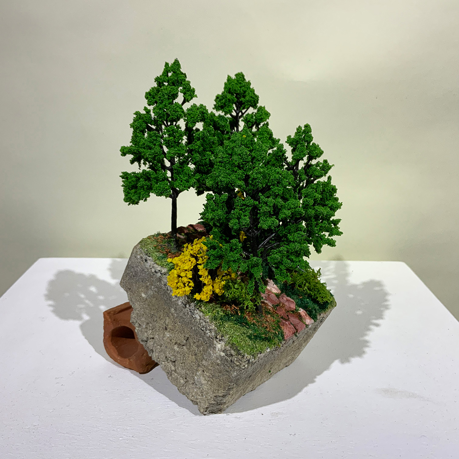 A miniature sculpture of a steep hillside path from On the Rubble of our Ancestors